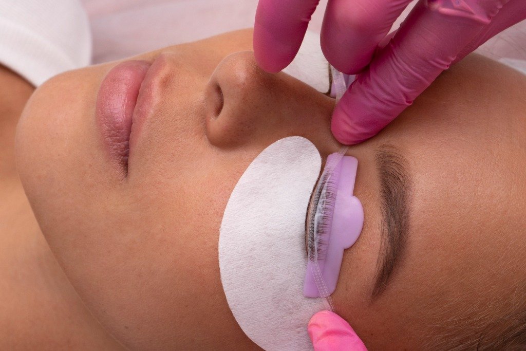 Professional lash lift treatment in progress